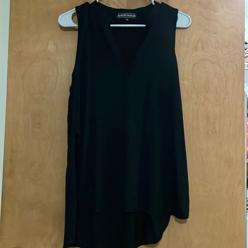 A size large black trash tank top perfect for blue jeans or dress pants